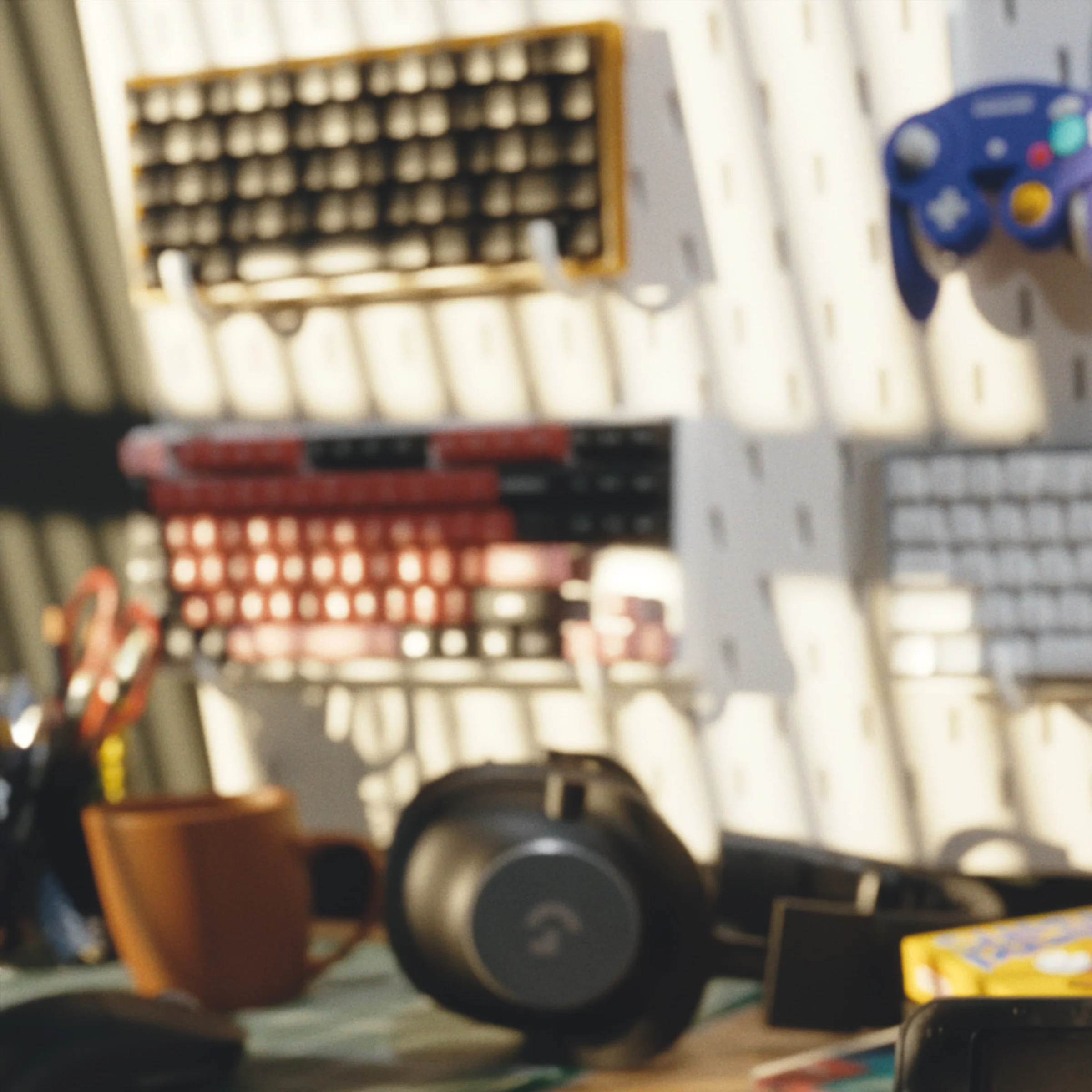 Headphones and controllers displayed on a wall behind the desk