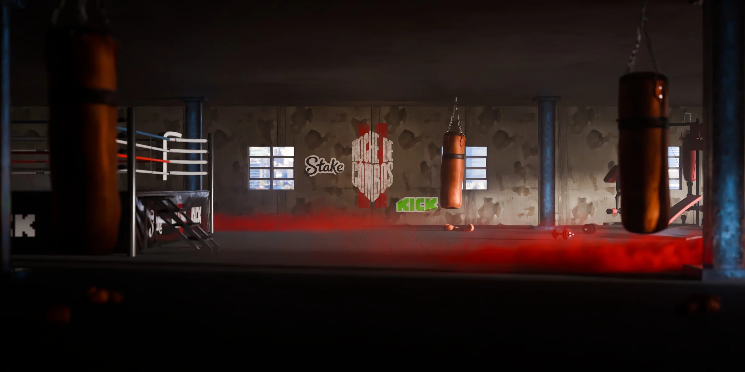 Red-lit boxing training space with branded heavy bags
